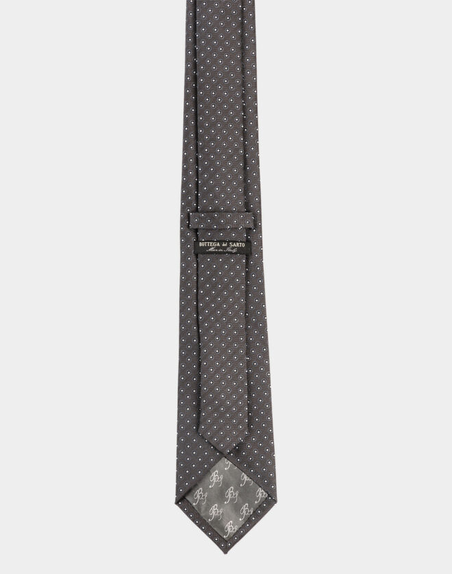 Cravatta in seta girgio scuro con motivo fantasia a cerchi