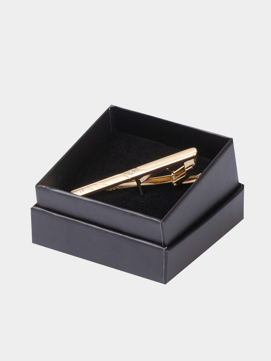 Oval gold tie clip with stone