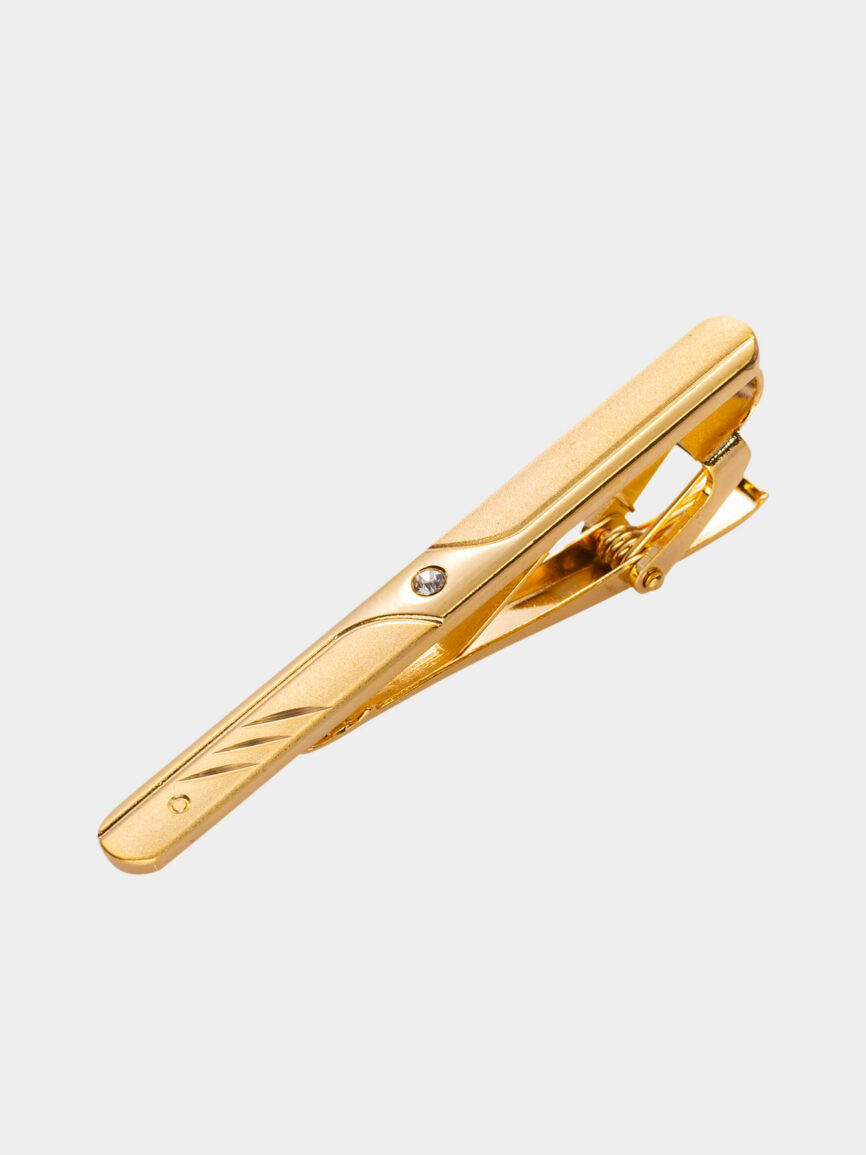 Oval gold tie clip with stone