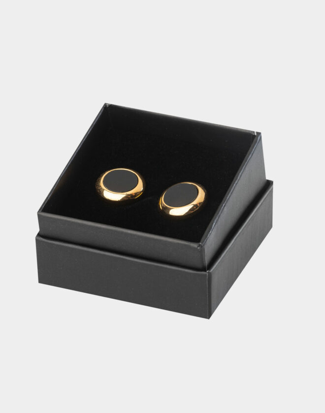 Gold-colored circular cufflinks with black stone