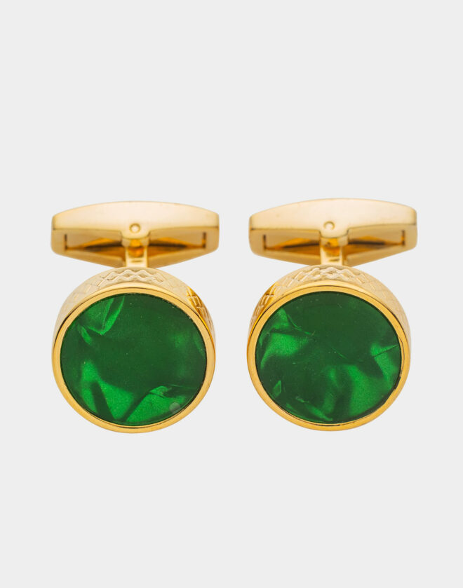 Gold-colored circular cufflinks with emerald green stone